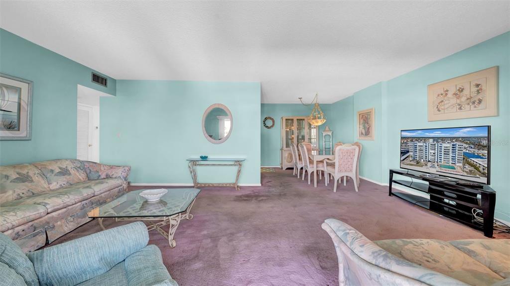17400 Gulf Boulevard, Unit I4 North Redington Beach, FL 33708 - Photo 16 of 30 a living room with furniture and a flat screen tv