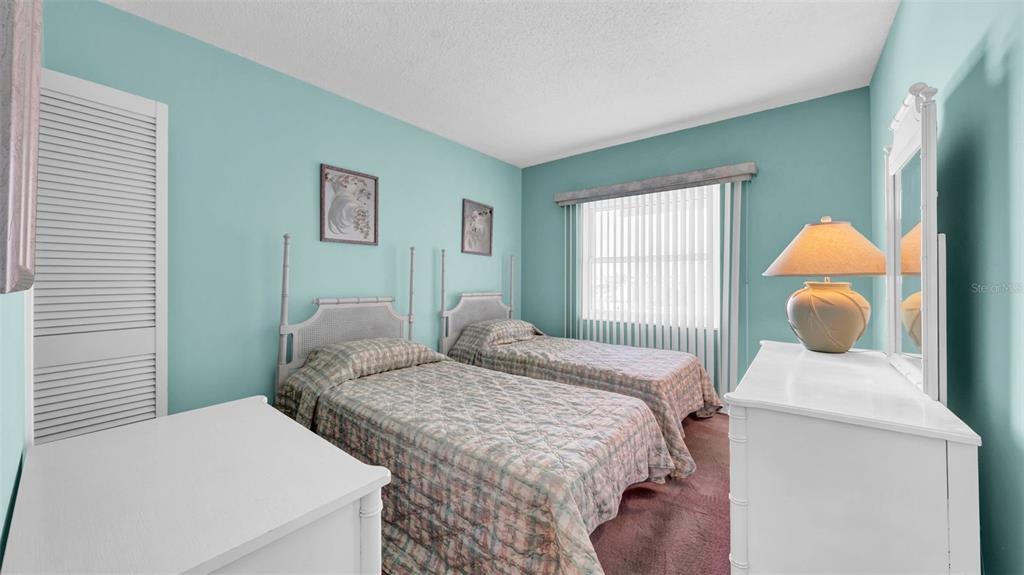 17400 Gulf Boulevard, Unit I4 North Redington Beach, FL 33708 - Photo 20 of 30 a bedroom with a bed and wooden floor