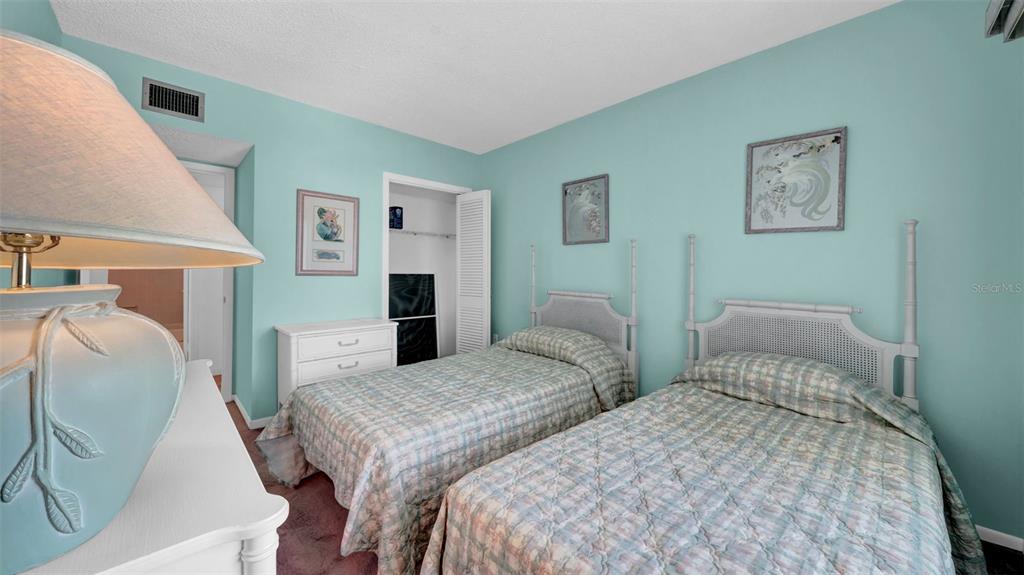 17400 Gulf Boulevard, Unit I4 North Redington Beach, FL 33708 - Photo 21 of 30 a bedroom with two beds and painting on the wall