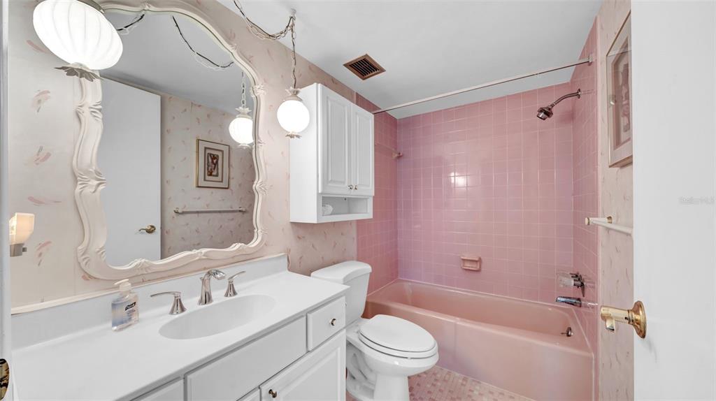 17400 Gulf Boulevard, Unit I4 North Redington Beach, FL 33708 - Photo 23 of 30 a bathroom with a sink a toilet and shower