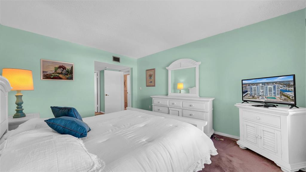 17400 Gulf Boulevard, Unit I4 North Redington Beach, FL 33708 - Photo 26 of 30 a bedroom with a bed and a television