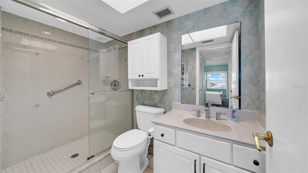 17400 Gulf Boulevard, Unit I4 North Redington Beach, FL 33708 - Photo 28 of 30 a bathroom with a sink toilet and shower