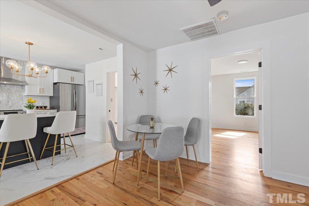 1100 Chester Street Durham, NC 27701 - Photo 17 of 43 a view of a dining room with furniture and wooden floor