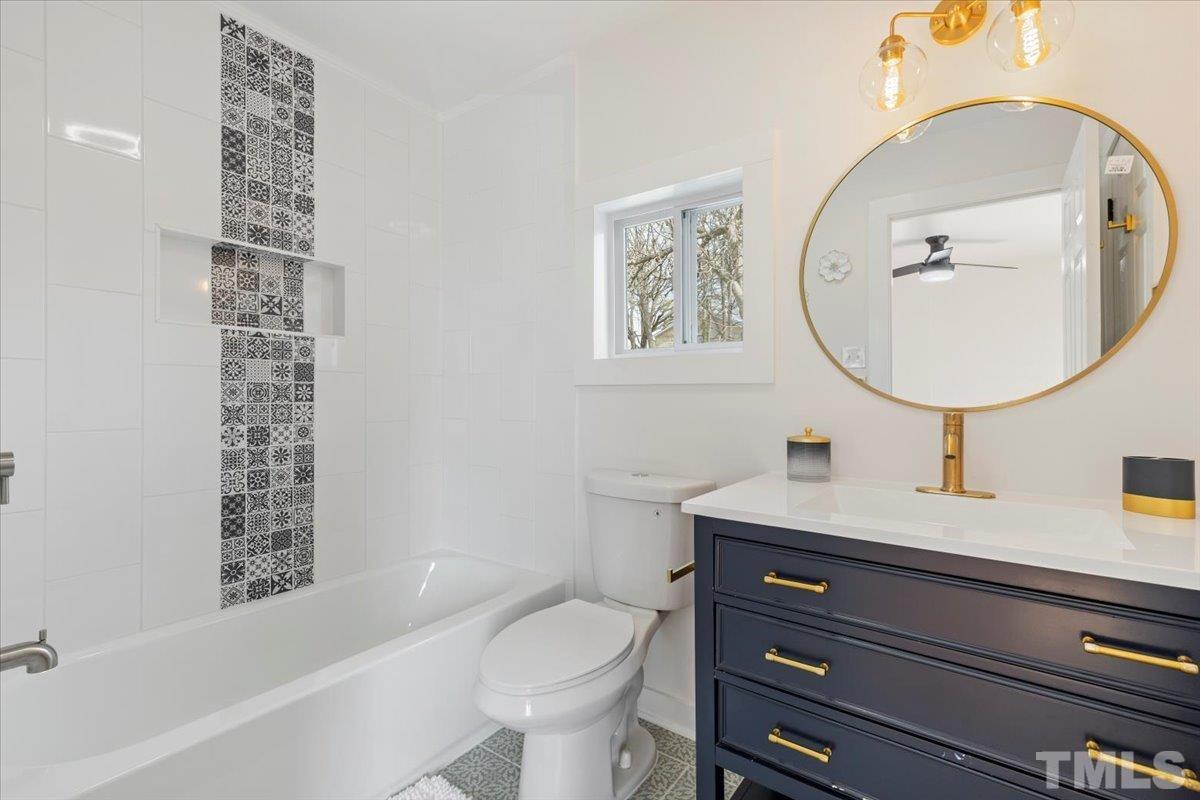 1100 Chester Street Durham, NC 27701 - Photo 23 of 43 a bathroom with a sink toilet and a mirror
