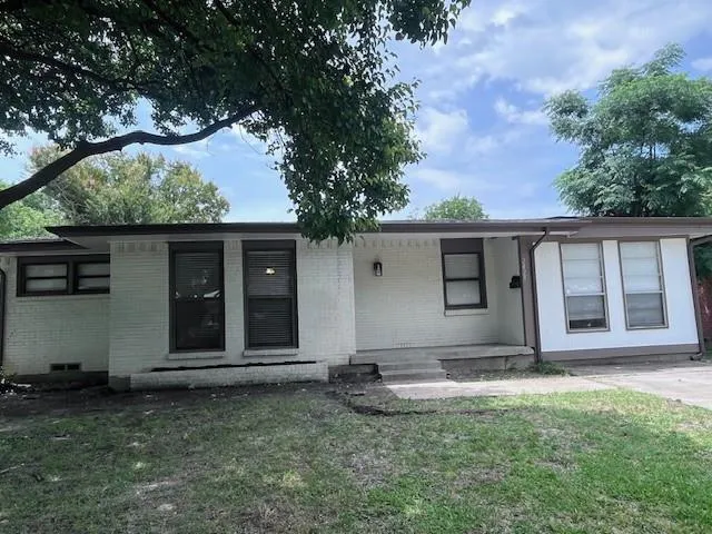 front view of a house with a garden