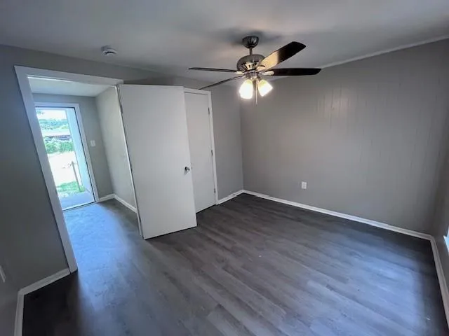 a kitchen with stainless steel appliances a refrigerator and wooden floor