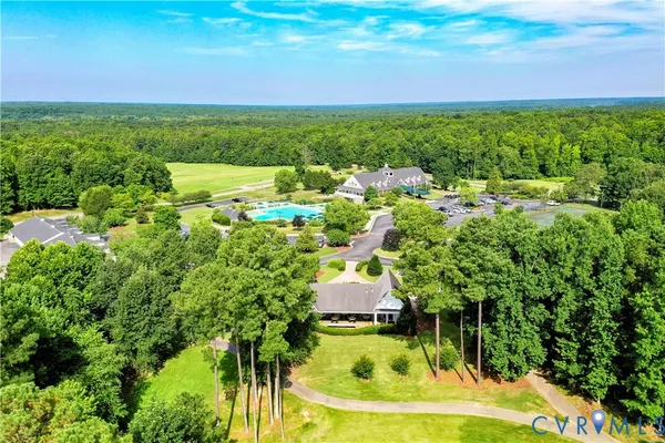 a view of a swimming pool with a yard