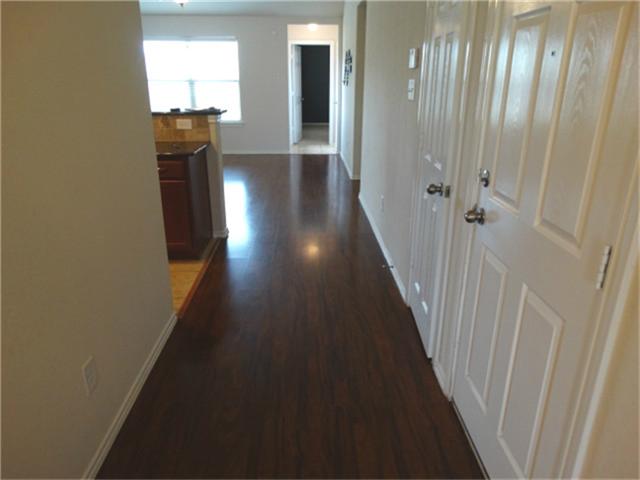 22618 Banter Point Lane Katy, TX 77449 - Photo 3 of 34 Elegant, rich wood flooring enhances the home's warmth and charm.