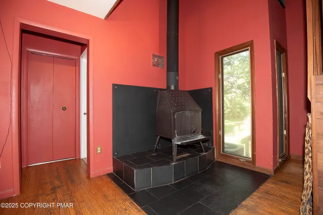 a kitchen with kitchen island granite countertop a sink a counter top space appliances and cabinets