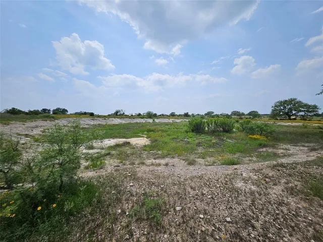 a view of a lake with houses in the back
