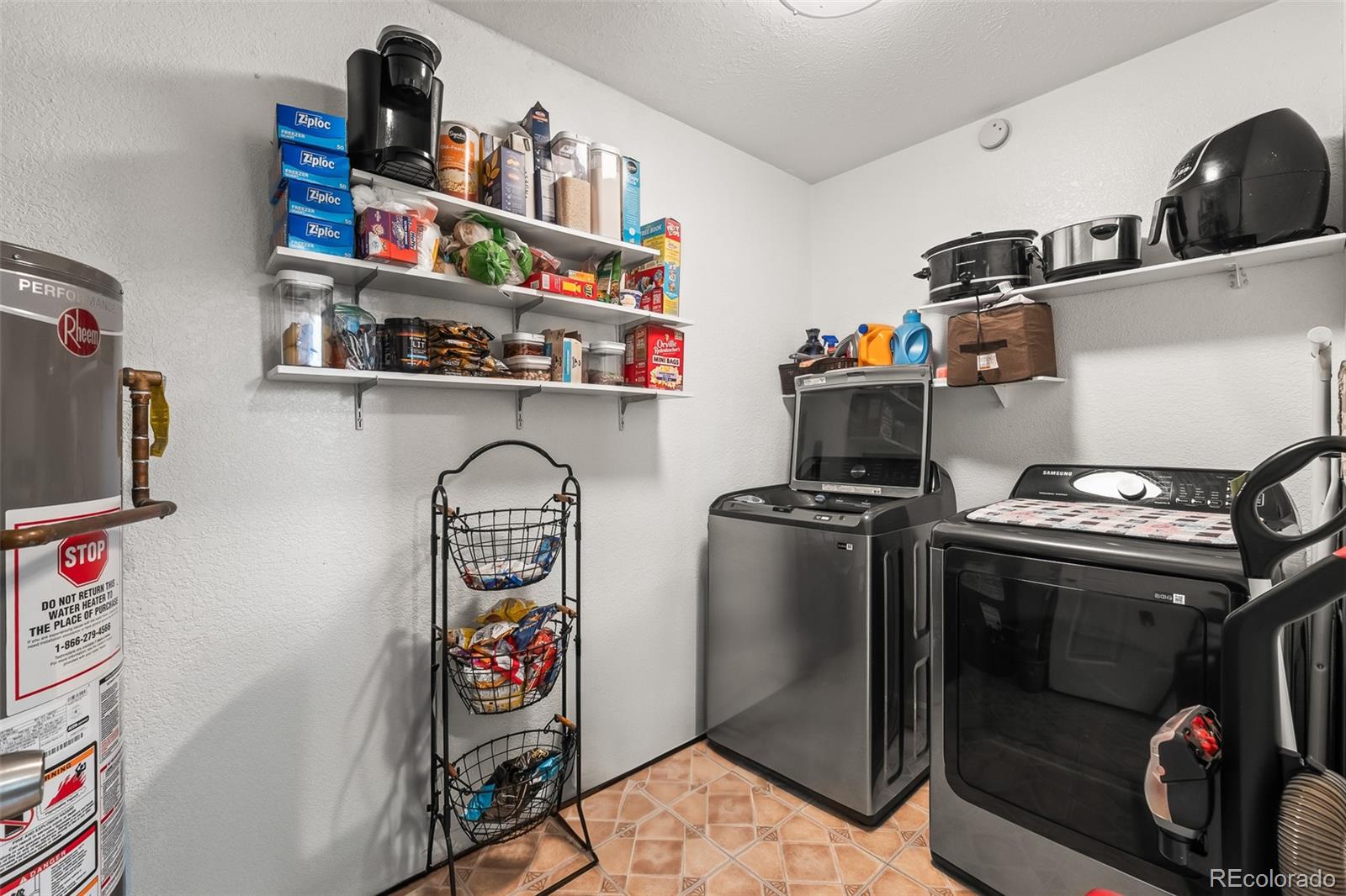 908 Trapper Drive Fort Lupton, CO 80621 - Photo 17 of 41 a utility room with dryer and washer