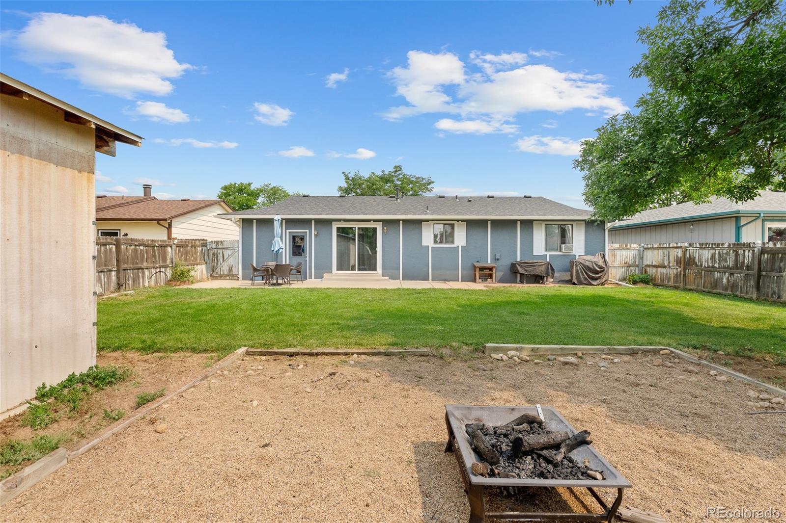 908 Trapper Drive Fort Lupton, CO 80621 - Photo 29 of 41 a front view of a house with garden