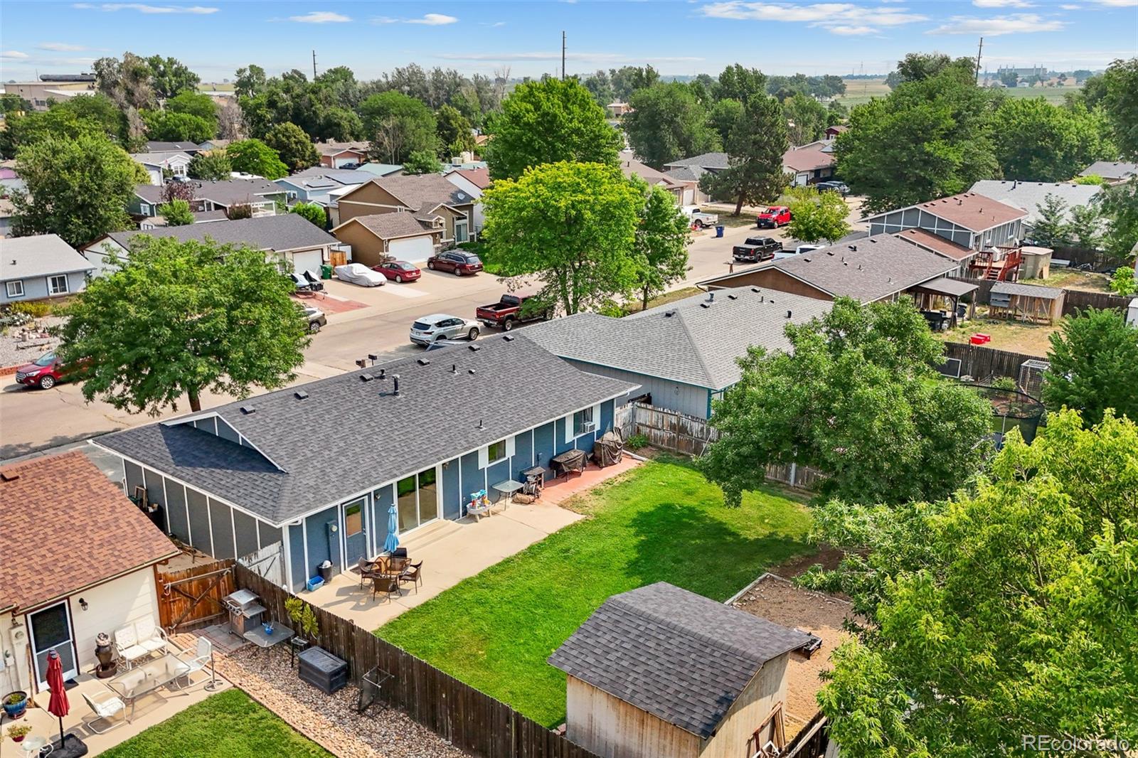 908 Trapper Drive Fort Lupton, CO 80621 - Photo 31 of 41 an aerial view of a house with a garden