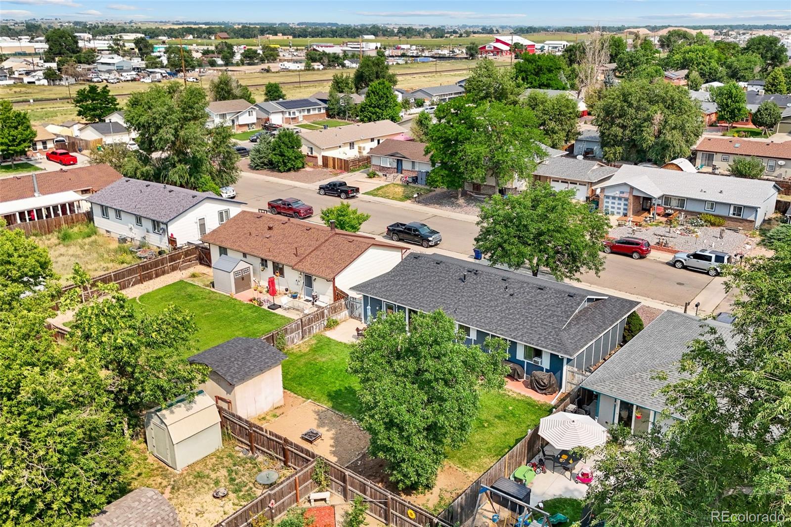 908 Trapper Drive Fort Lupton, CO 80621 - Photo 34 of 41 an aerial view of residential houses with outdoor space and street view