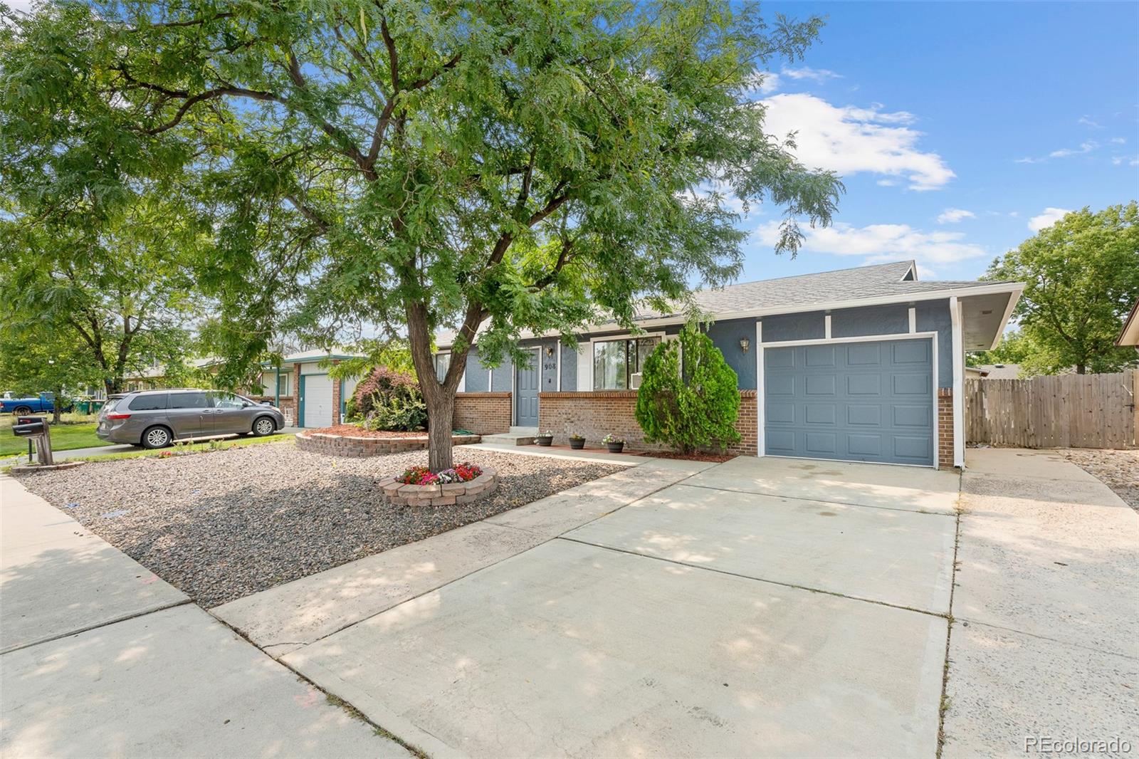 908 Trapper Drive Fort Lupton, CO 80621 - Photo 4 of 41 a view of a street with houses