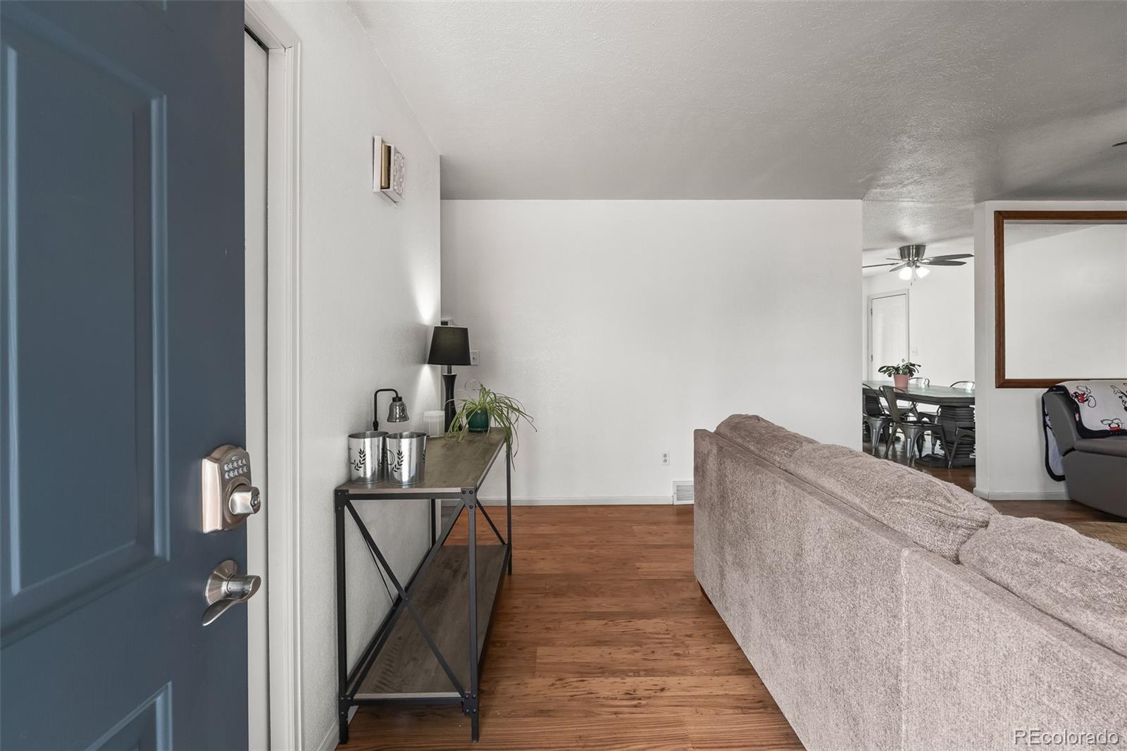908 Trapper Drive Fort Lupton, CO 80621 - Photo 7 of 41 a view of a living room with furniture