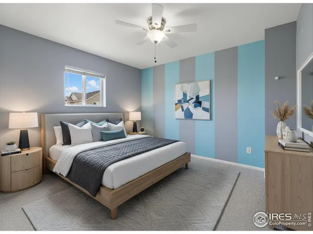 a spacious bedroom with a bed and a chandelier