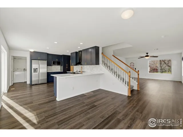 a view of kitchen with cabinets and wooden floor