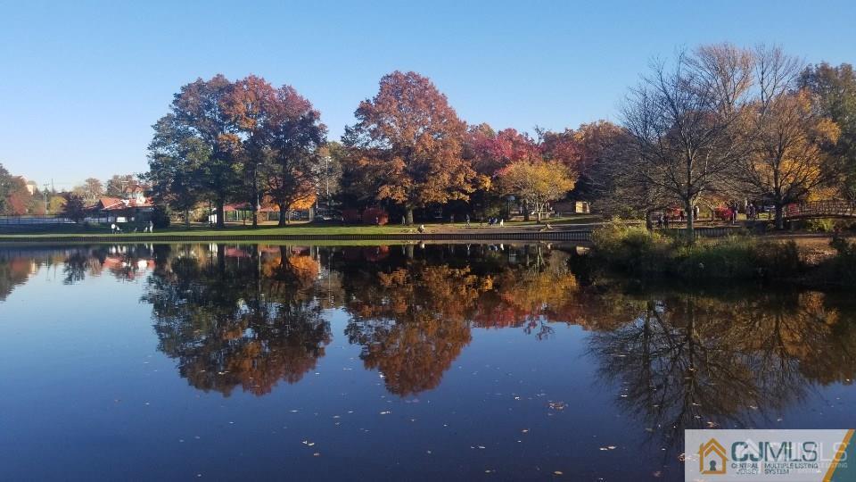 57 Judson Street, Unit 1B Edison, NJ 08837 - Photo 18 of 21 a wooden deck with lake view