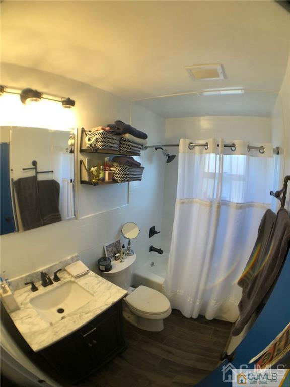 57 Judson Street, Unit 1B Edison, NJ 08837 - Photo 2 of 21 a bathroom with a sink and a mirror