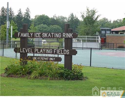 57 Judson Street, Unit 1B Edison, NJ 08837 - Photo 21 of 21 a sign that is sitting on a brick wall