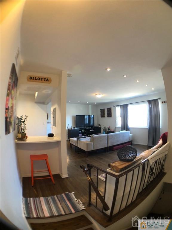 57 Judson Street, Unit 1B Edison, NJ 08837 - Photo 4 of 21 a living room with furniture and a dining table