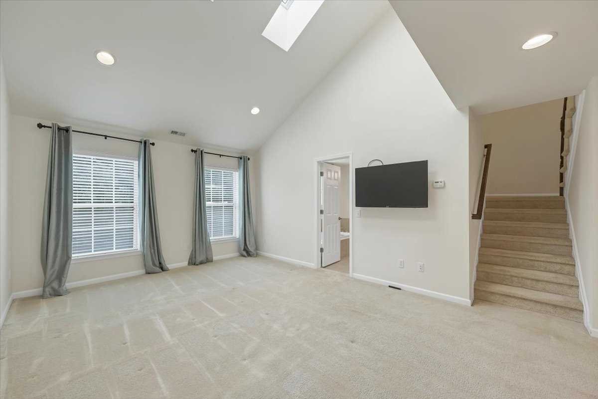 2507 Sylvan Loop Fishkill, NY 12590 - Photo 14 of 37 a view of an empty room with wooden floor and windows