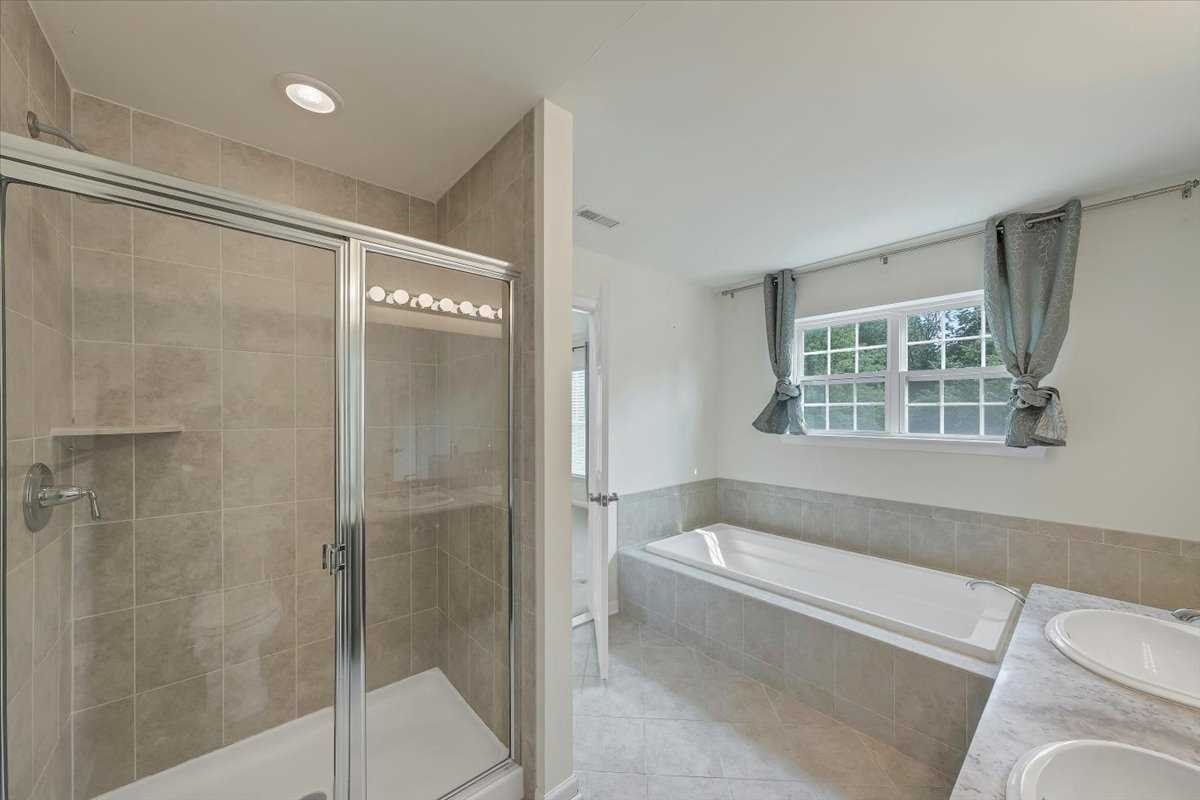 2507 Sylvan Loop Fishkill, NY 12590 - Photo 17 of 37 a bathroom with a bathtub and a shower