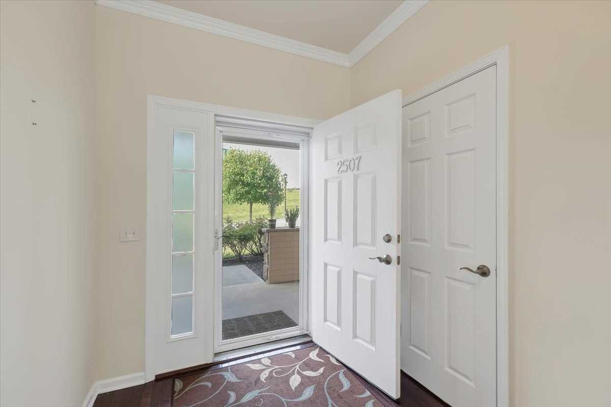 2507 Sylvan Loop Fishkill, NY 12590 - Photo 4 of 37 a view of a hallway with wooden floor and a door