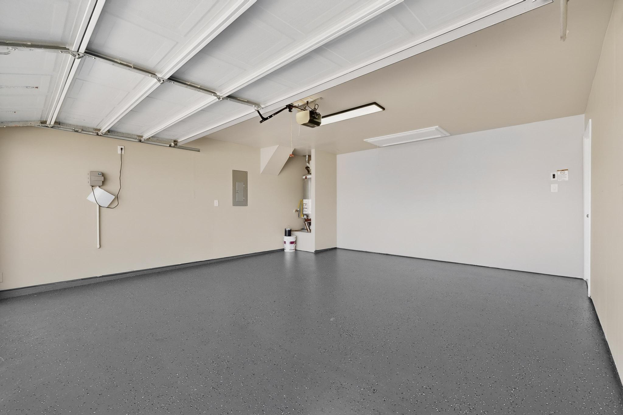 218 Sickle Loop Kyle, TX 78640 - Photo 28 of 34 Garage with gas water heater and electric panel