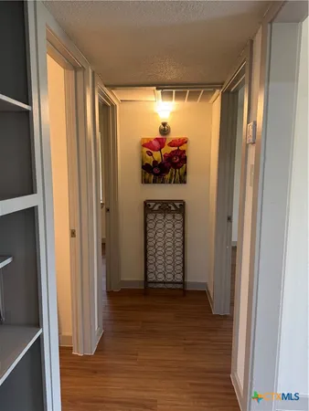 a view of kitchen with cabinets