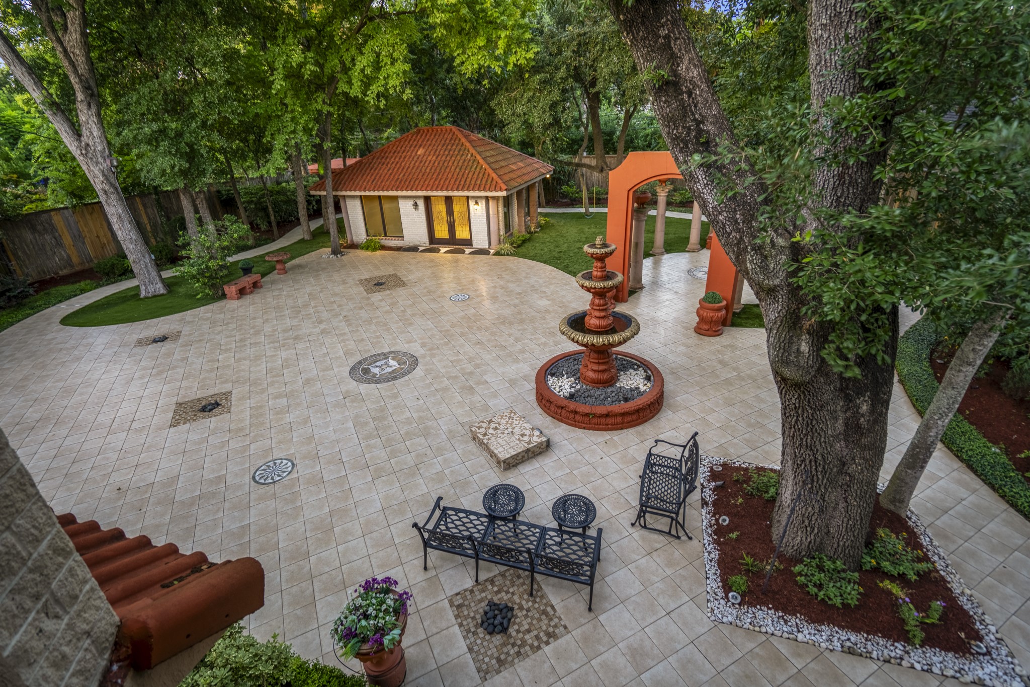 6535 Buffalo Speedway Houston, TX 77005 - Photo 5 of 40 The expansive backyard includes over 5,000 square feet of recently installed tile and artificial turf as well as a detached guest house, which is not included in the total square footage. Low-maintenance, beautiful, and made for both enjoyment and entertainment.
