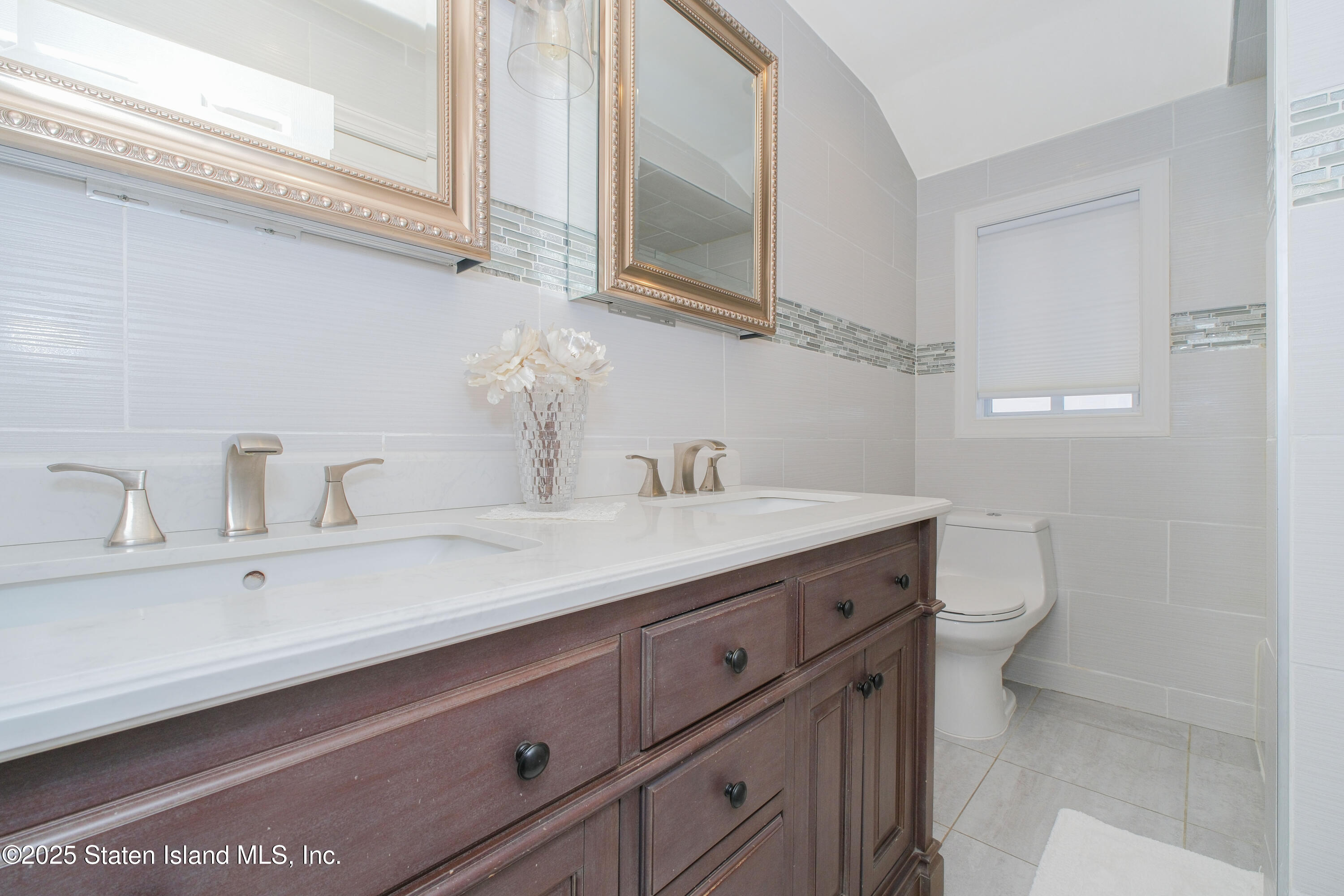 149 Crossfield Avenue Staten Island, NY 10312 - Photo 11 of 23 a bathroom with a sink and a toilet