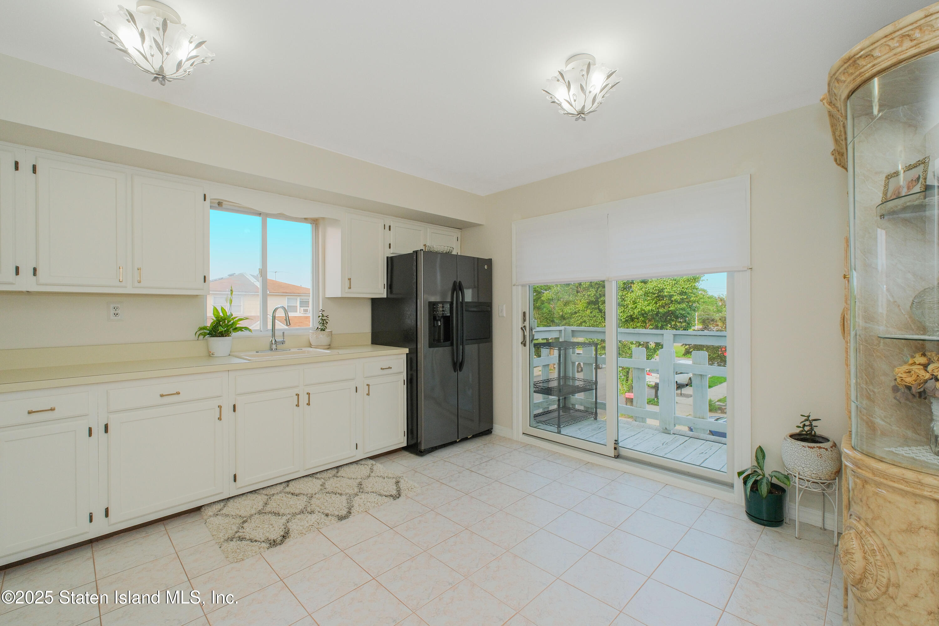 149 Crossfield Avenue Staten Island, NY 10312 - Photo 12 of 23 a kitchen with a refrigerator a sink and a window