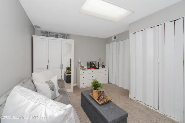 a view of a chair and tables in balcony