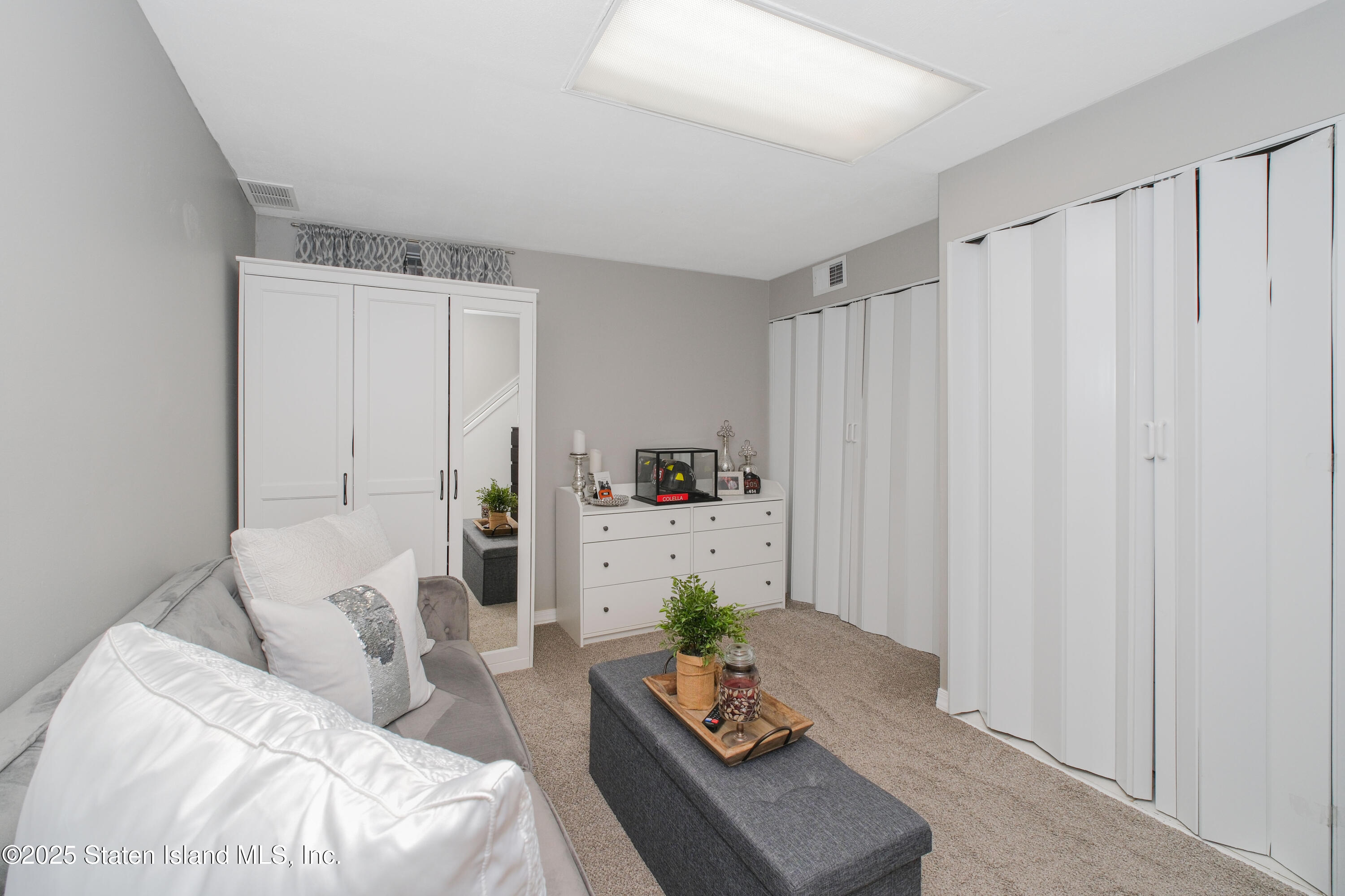 149 Crossfield Avenue Staten Island, NY 10312 - Photo 19 of 23 a living room with furniture and a window