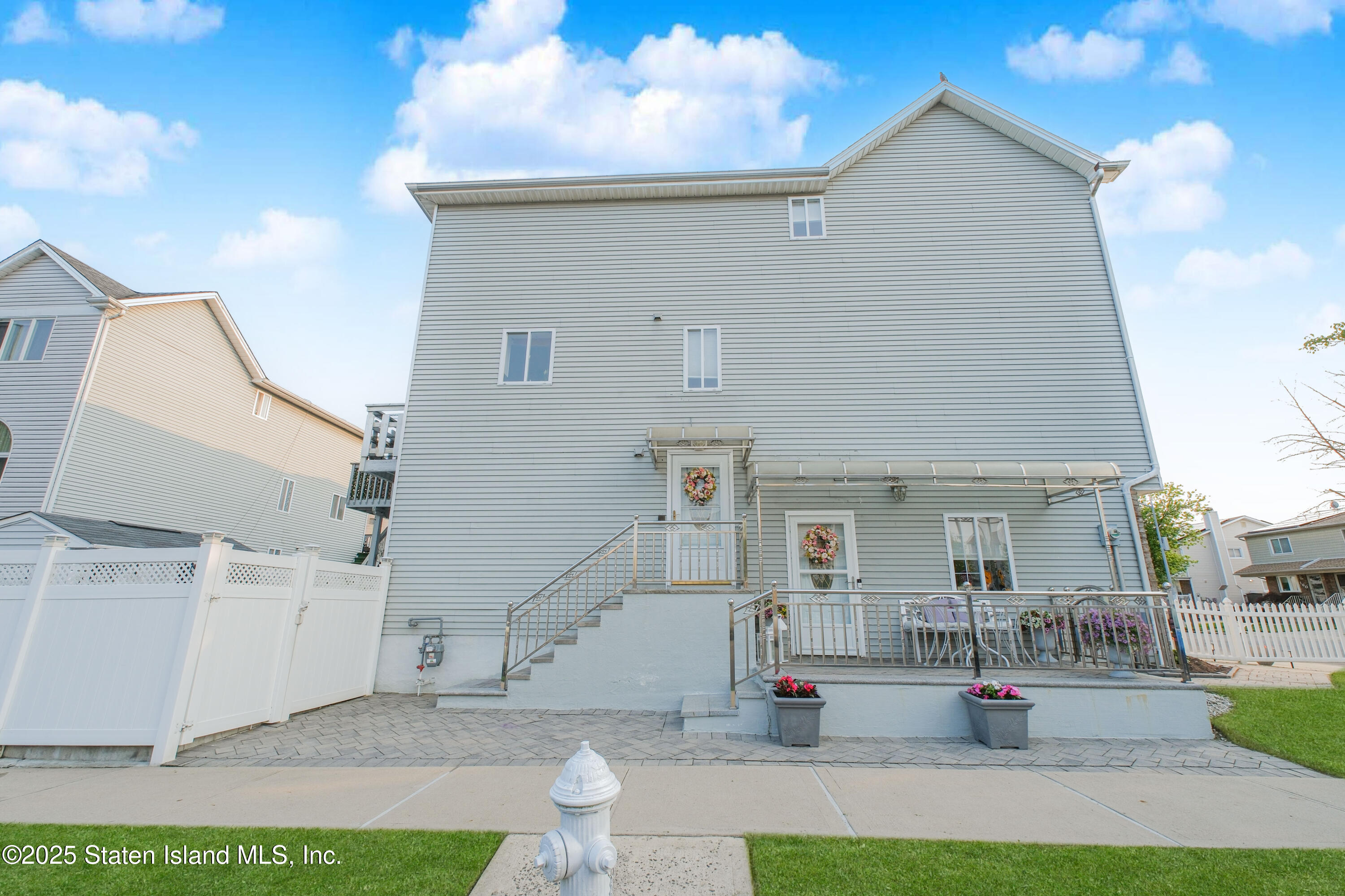 149 Crossfield Avenue Staten Island, NY 10312 - Photo 2 of 23 a front view of a house with a yard