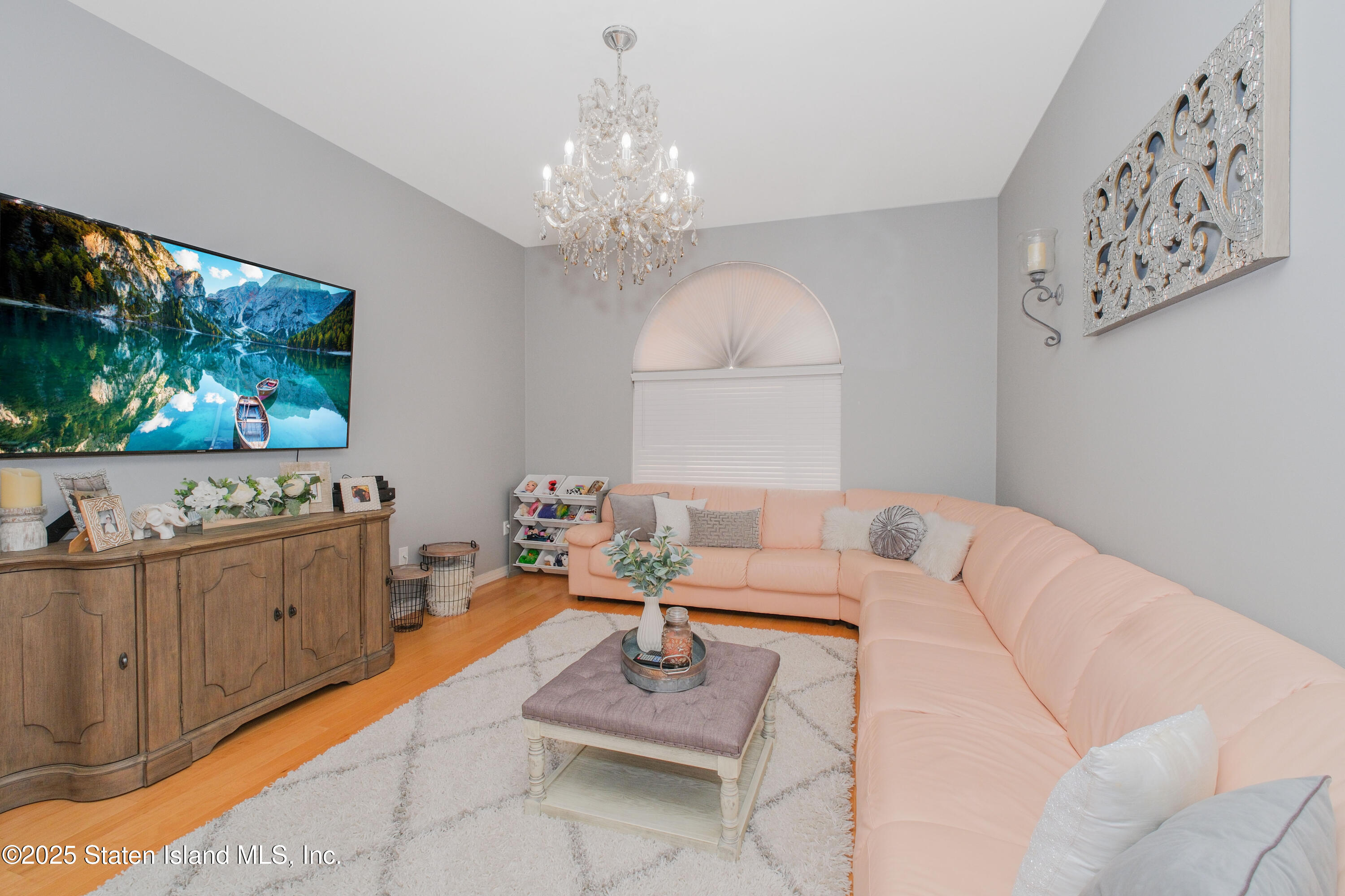 149 Crossfield Avenue Staten Island, NY 10312 - Photo 9 of 23 a living room with furniture and a flat screen tv