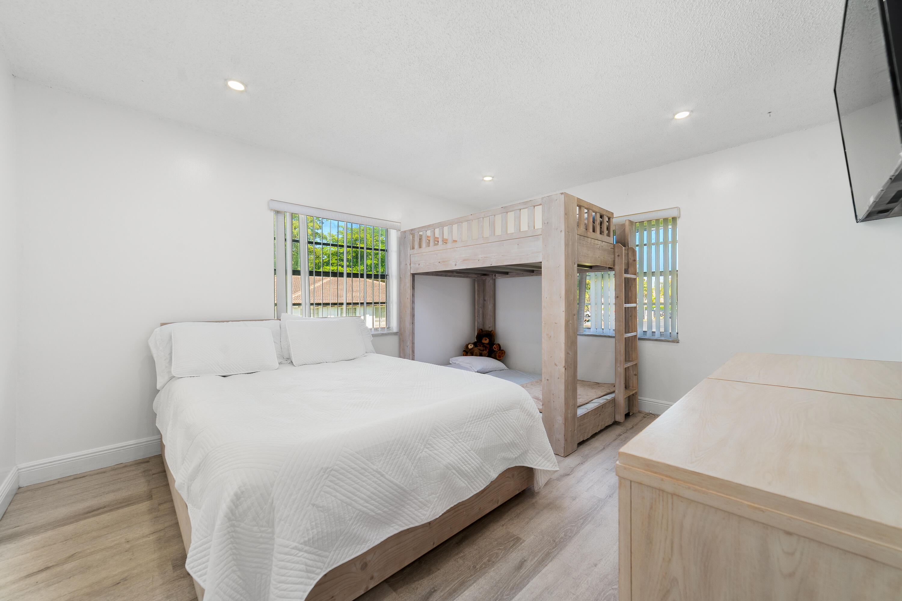 2710 Riverside Drive, Unit 201A Coral Springs, FL 33065 - Photo 14 of 23 a bedroom with a bed and a window