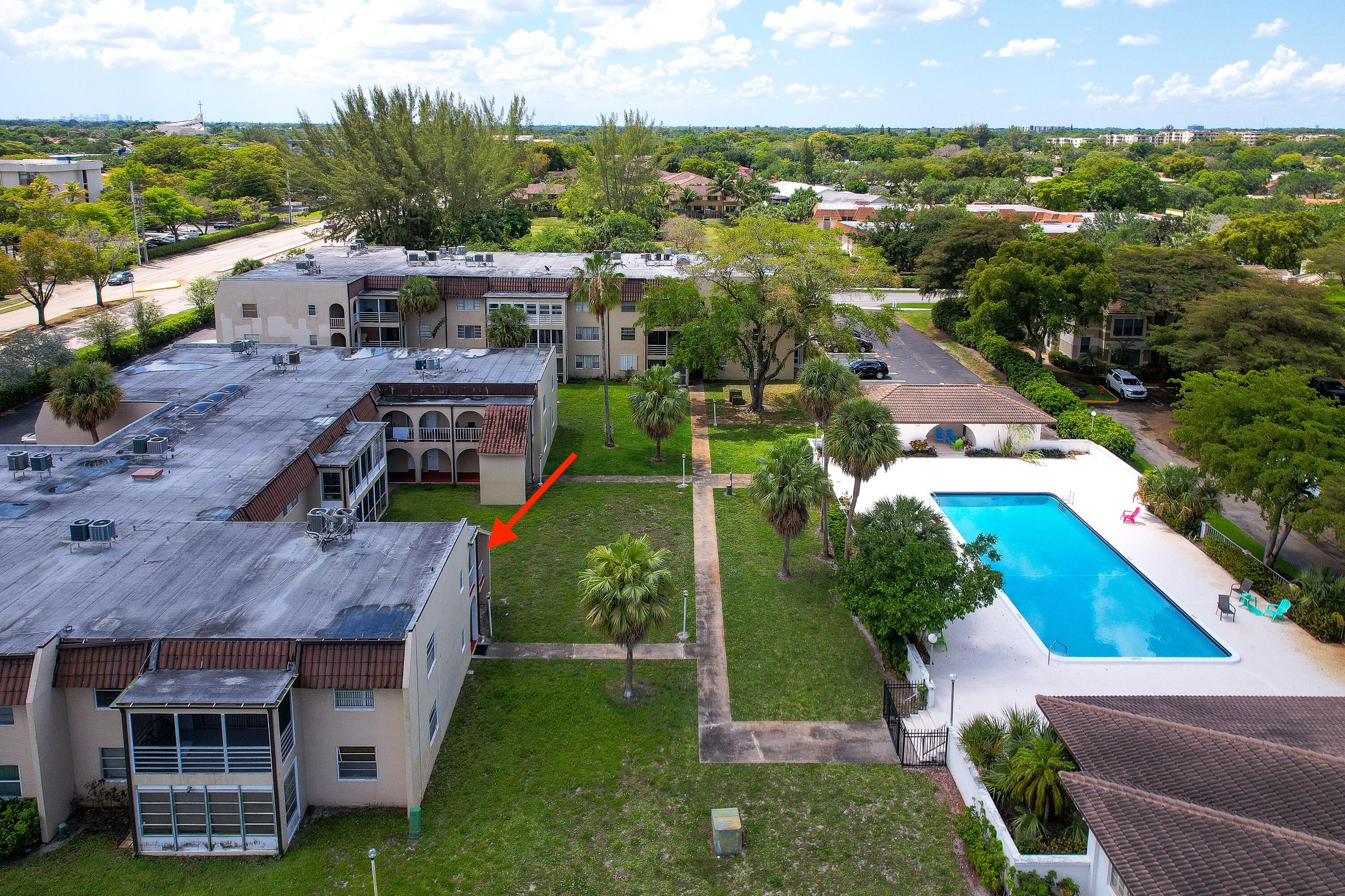 2710 Riverside Drive, Unit 201A Coral Springs, FL 33065 - Photo 22 of 23 an aerial view of multiple houses with a yard