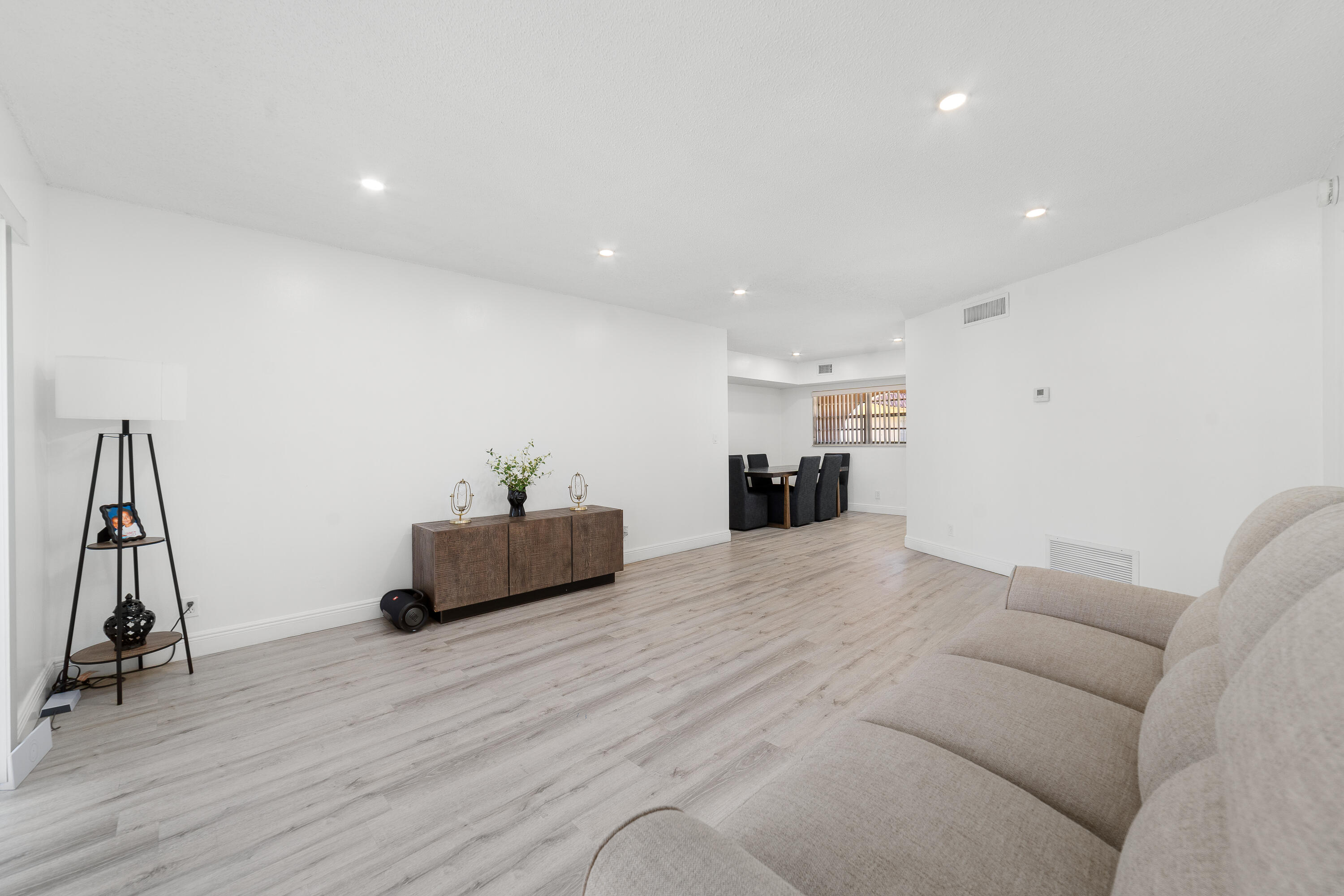 2710 Riverside Drive, Unit 201A Coral Springs, FL 33065 - Photo 5 of 23 a living room with furniture and a wooden floor