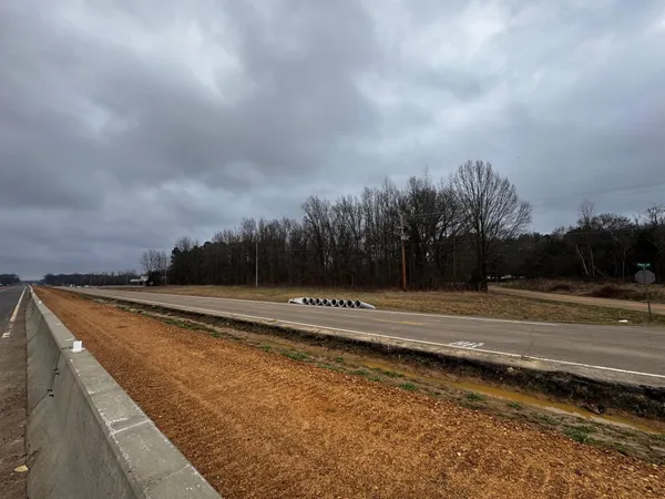 a view of swimming pool with trees in the background