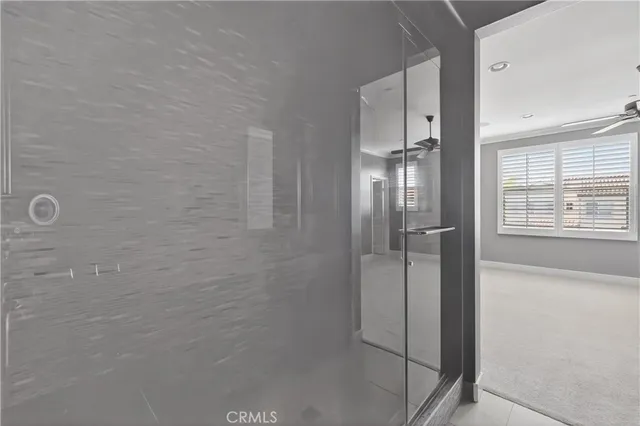 a bathroom with a glass shower door