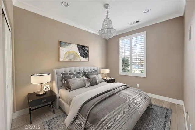 a bedroom with bed and a window