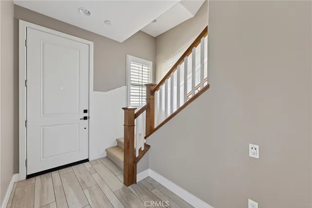 a view of entryway with wooden floor