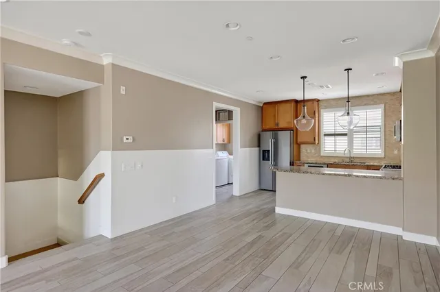 a view of a kitchen with a dishwasher cabinets and wooden floor