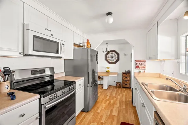 a kitchen with a stove and a microwave