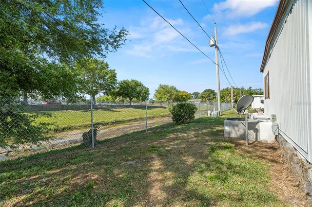 a view of a park with large trees