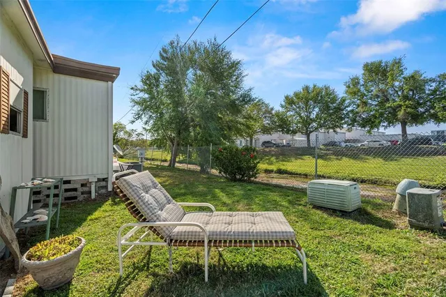a view of a swimming pool with back yard