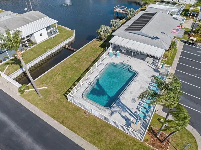 an aerial view of a house with a swimming pool